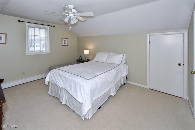 bedroom with light carpet, baseboards, a ceiling fan, vaulted ceiling, and a baseboard heating unit