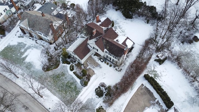 snowy aerial view with a residential view