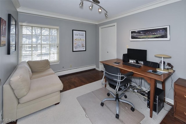 home office with a baseboard heating unit, ornamental molding, track lighting, wood finished floors, and baseboards