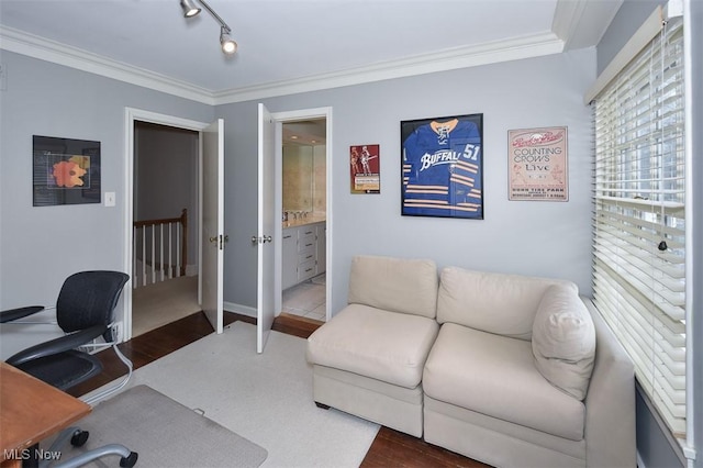 home office featuring track lighting, wood finished floors, and crown molding