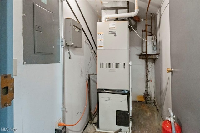 utility room featuring heating unit and electric panel