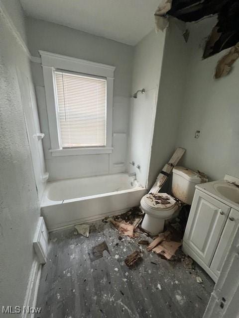 full bathroom with bathtub / shower combination, vanity, and toilet