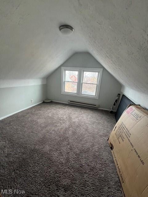 bonus room featuring a textured ceiling, lofted ceiling, carpet flooring, baseboards, and baseboard heating