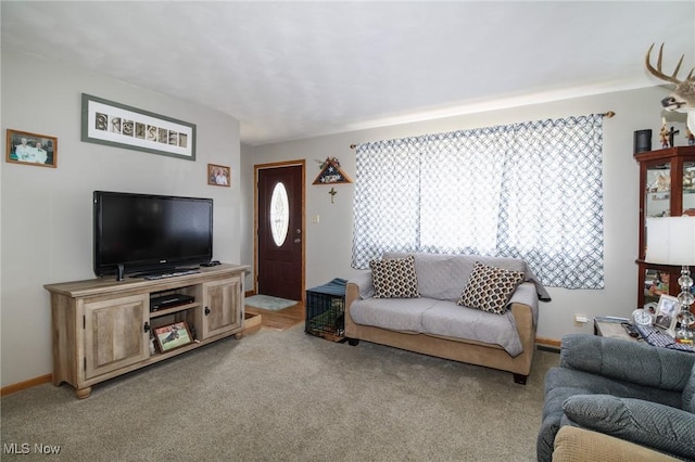 living room featuring light colored carpet and baseboards