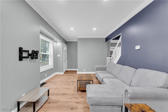 living area with baseboards, light wood-style flooring, stairway, crown molding, and recessed lighting