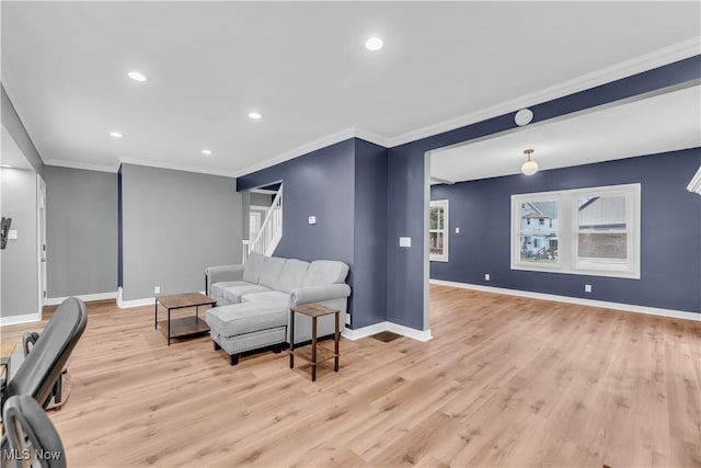 living room featuring ornamental molding, recessed lighting, light wood-style flooring, and baseboards