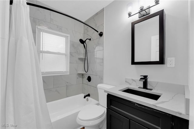 full bathroom featuring toilet, shower / bath combo, and vanity