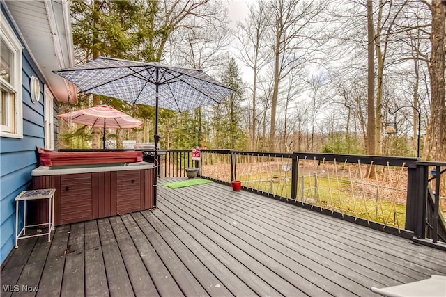 wooden terrace with a hot tub