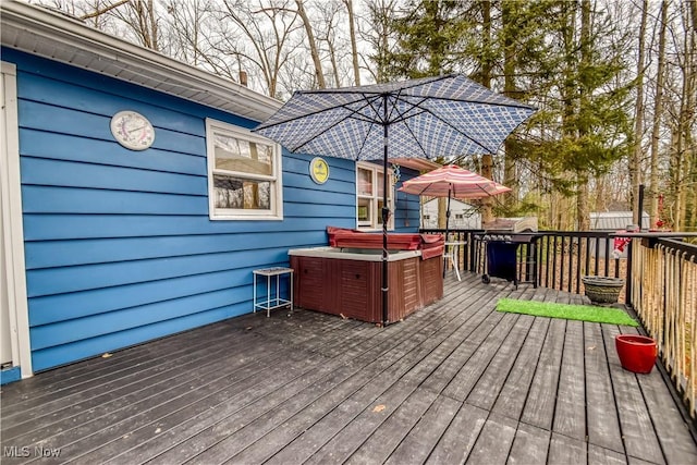 deck with a hot tub