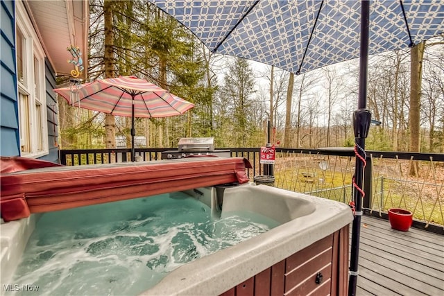 deck featuring a grill and a hot tub