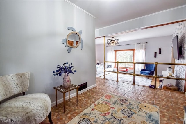 interior space featuring ornamental molding, tile patterned flooring, and baseboards