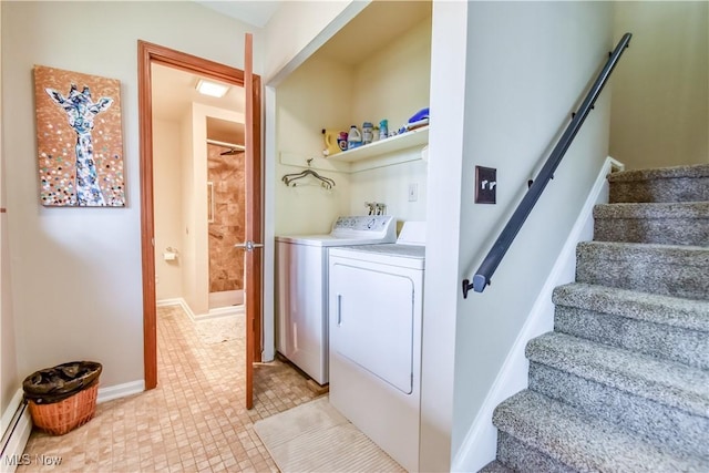 washroom featuring laundry area, baseboards, independent washer and dryer, and baseboard heating