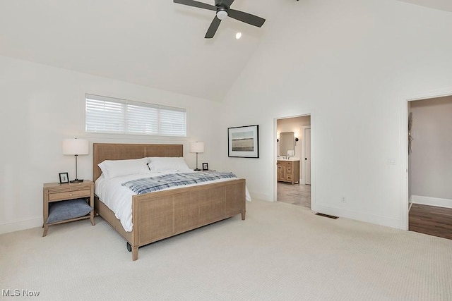 bedroom featuring baseboards, visible vents, a ceiling fan, light colored carpet, and high vaulted ceiling