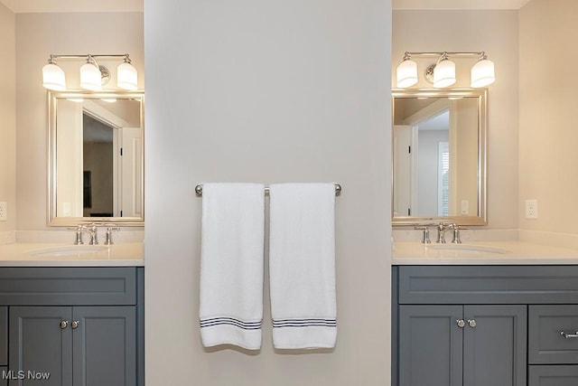 bathroom with two vanities and a sink