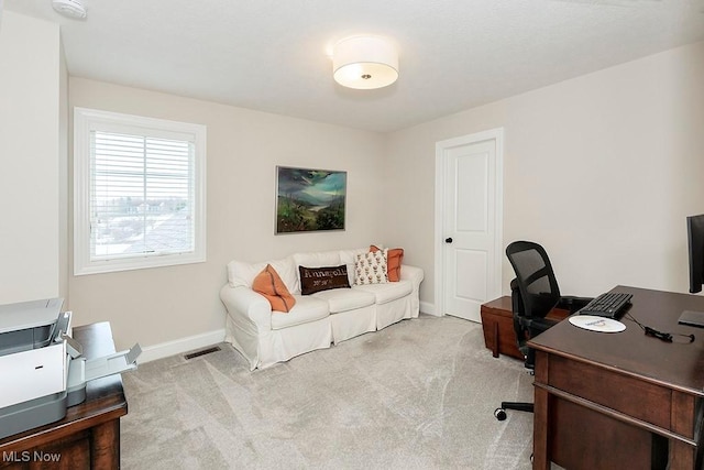 office area featuring carpet floors, visible vents, and baseboards