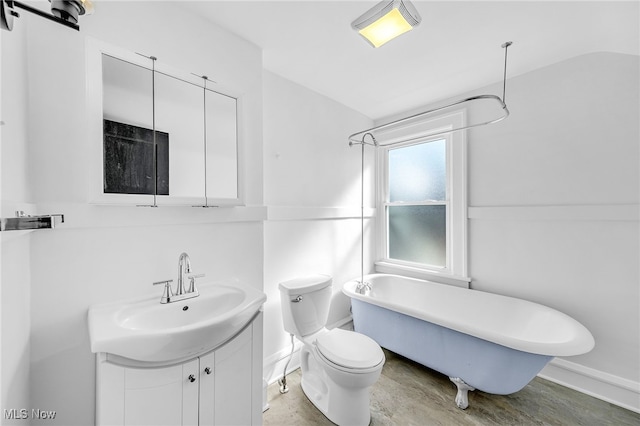 full bathroom with a soaking tub, toilet, vanity, wood finished floors, and baseboards