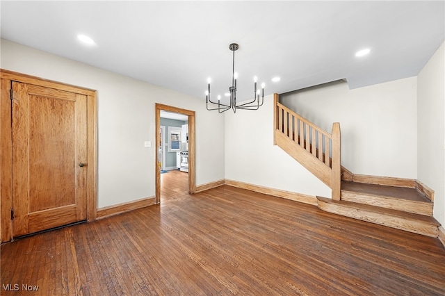 unfurnished dining area with stairs, baseboards, hardwood / wood-style floors, and recessed lighting