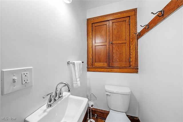 bathroom with a sink and toilet