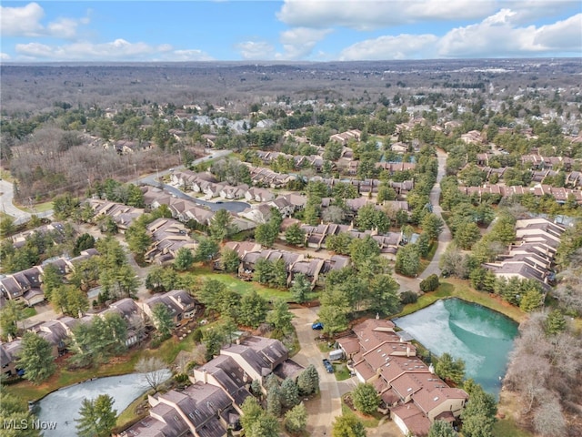 drone / aerial view with a residential view and a water view