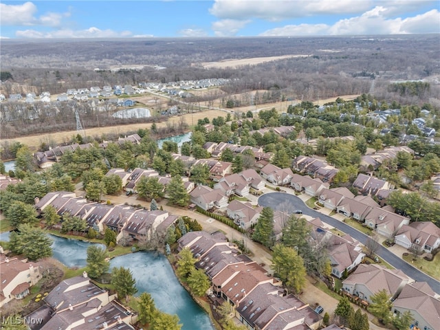 drone / aerial view featuring a residential view and a water view