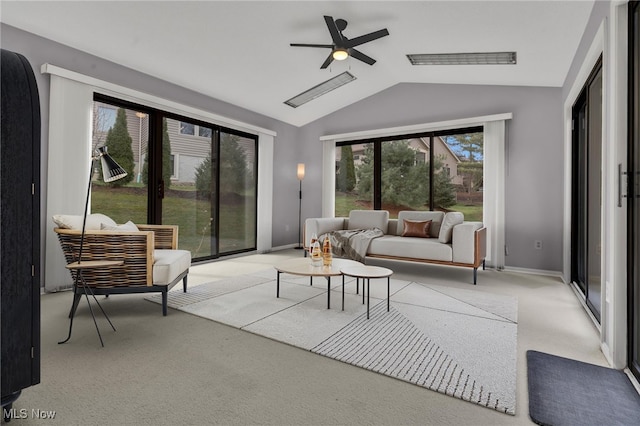 living area with visible vents, carpet flooring, baseboards, and vaulted ceiling