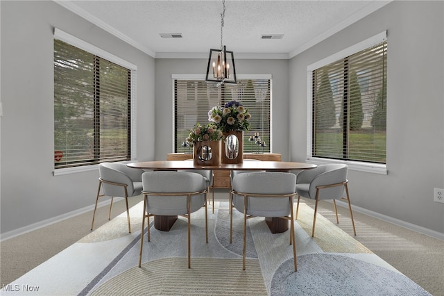 dining room with visible vents, baseboards, and a textured ceiling