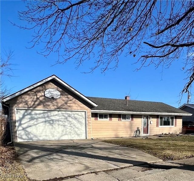 single story home with driveway, an attached garage, a front yard, and roof with shingles