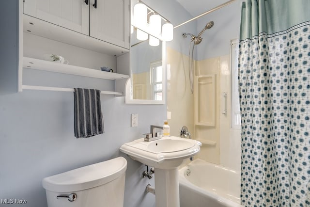 full bathroom with shower / bath combo and toilet