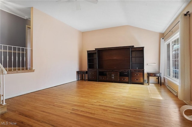 unfurnished living room featuring vaulted ceiling, ceiling fan, stairs, and light wood-style flooring