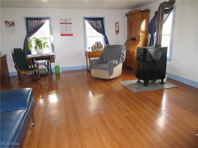 living area with baseboards and light wood-style floors