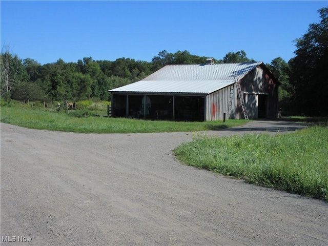 exterior space featuring an outdoor structure