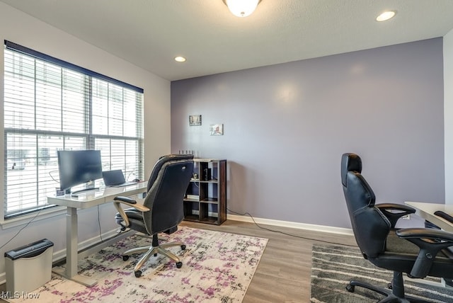 office with recessed lighting, wood finished floors, and baseboards