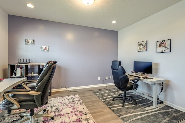 office area featuring recessed lighting, wood finished floors, and baseboards