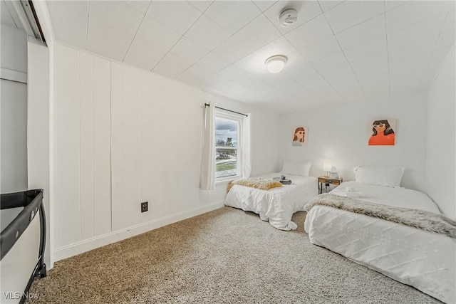 bedroom with carpet flooring and baseboards