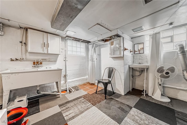 basement featuring concrete block wall