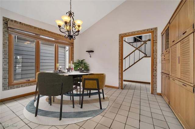 dining room with an inviting chandelier, stairs, vaulted ceiling, and light tile patterned flooring