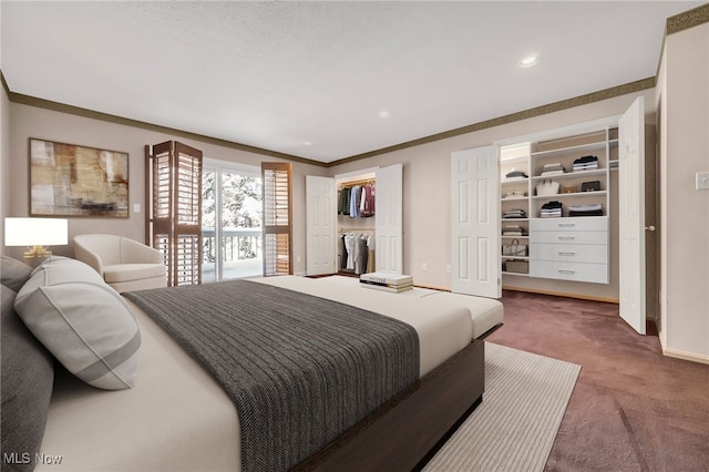 bedroom featuring a walk in closet, recessed lighting, ornamental molding, carpet flooring, and baseboards