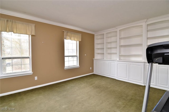 unfurnished office with ornamental molding, dark carpet, and baseboards