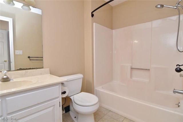 bathroom with tile patterned flooring, bathing tub / shower combination, toilet, and vanity