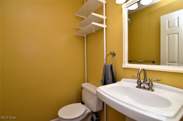 bathroom with a sink and toilet