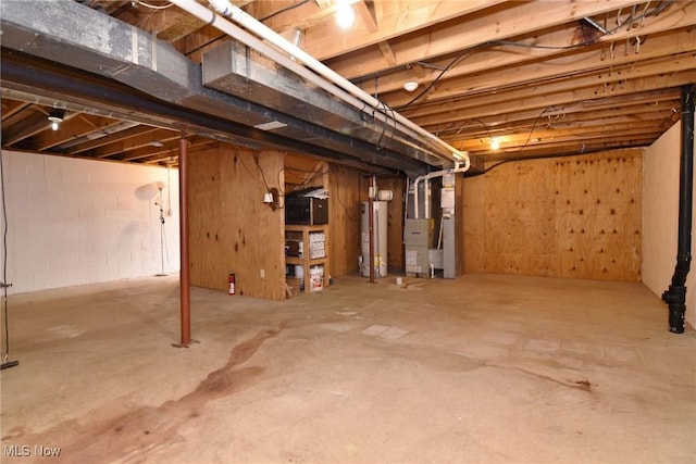 unfinished below grade area with gas water heater and heating unit