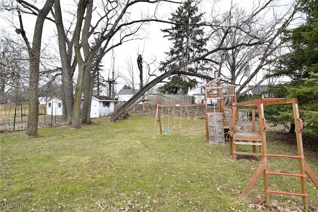 view of yard with an outbuilding and a playground