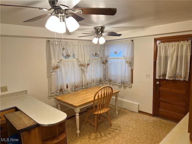 dining space featuring baseboards