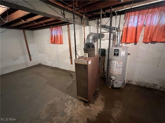 unfinished basement featuring gas water heater