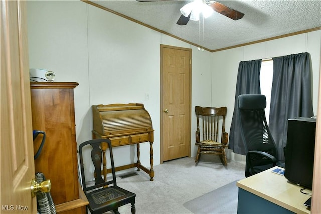 office featuring light colored carpet, ceiling fan, ornamental molding, vaulted ceiling, and a textured ceiling