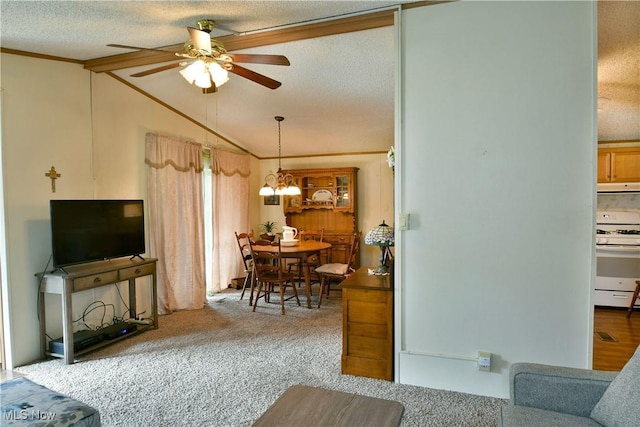 living area featuring lofted ceiling, crown molding, carpet floors, and a textured ceiling