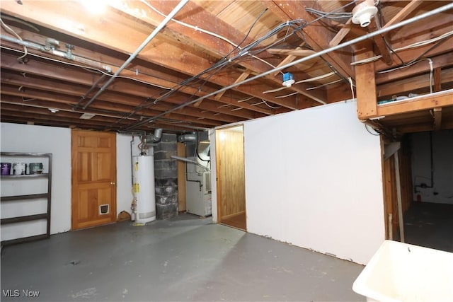 unfinished basement with heating unit and water heater