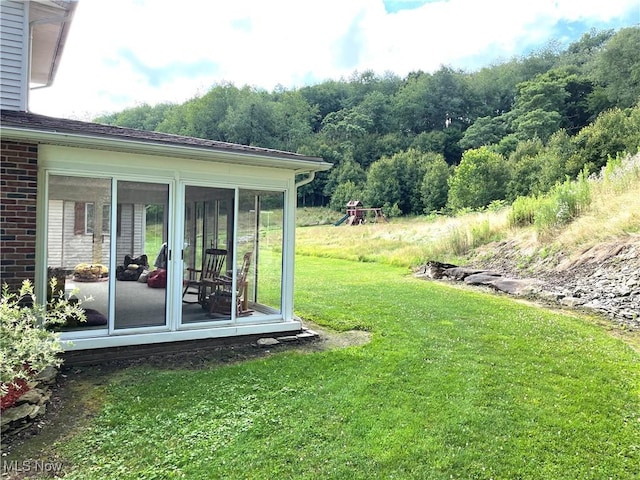 view of yard featuring a sunroom