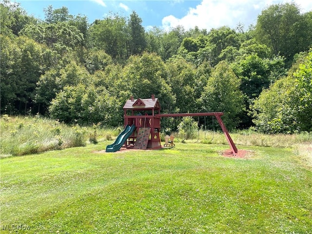 view of jungle gym with a lawn