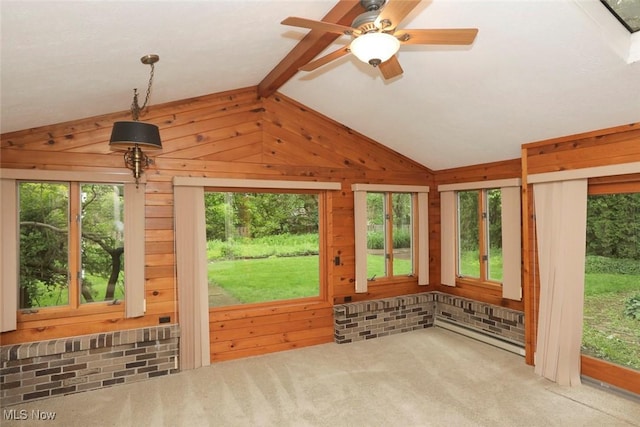 unfurnished sunroom with vaulted ceiling with beams, a ceiling fan, and a healthy amount of sunlight